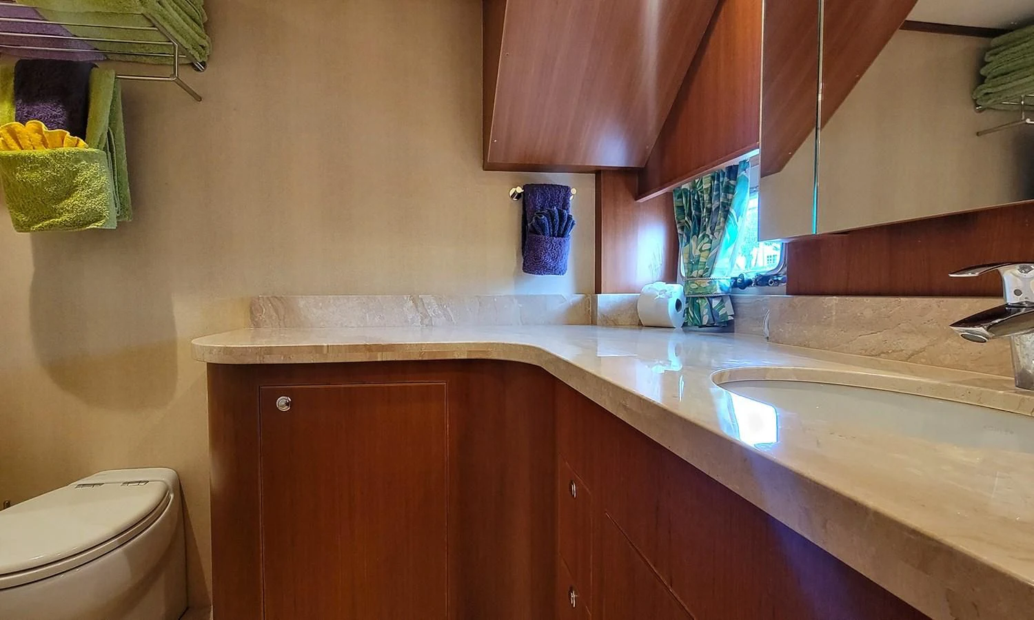 a bathroom with a sink and a toilet aboard SUERTUDO Yacht for Sale