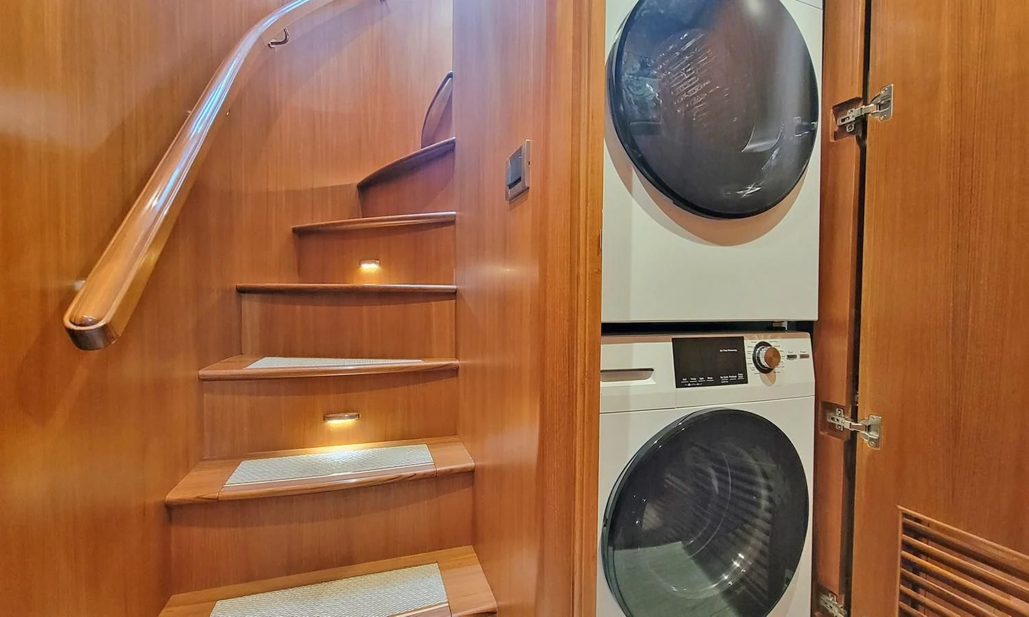 a closet with a washer and dryer aboard SUERTUDO Yacht for Sale