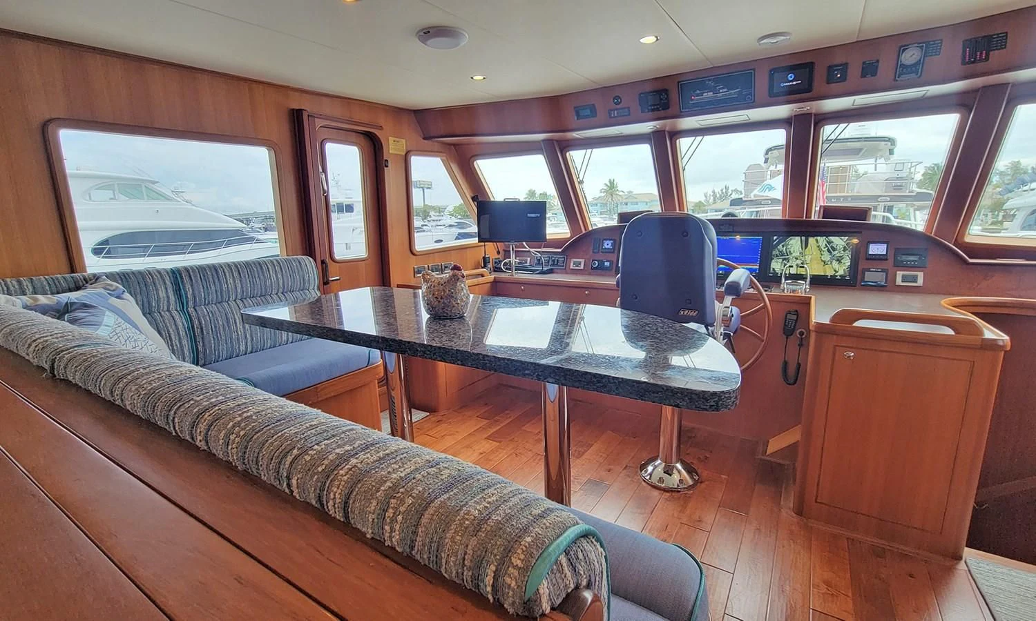 a living room with a couch and a table aboard SUERTUDO Yacht for Sale