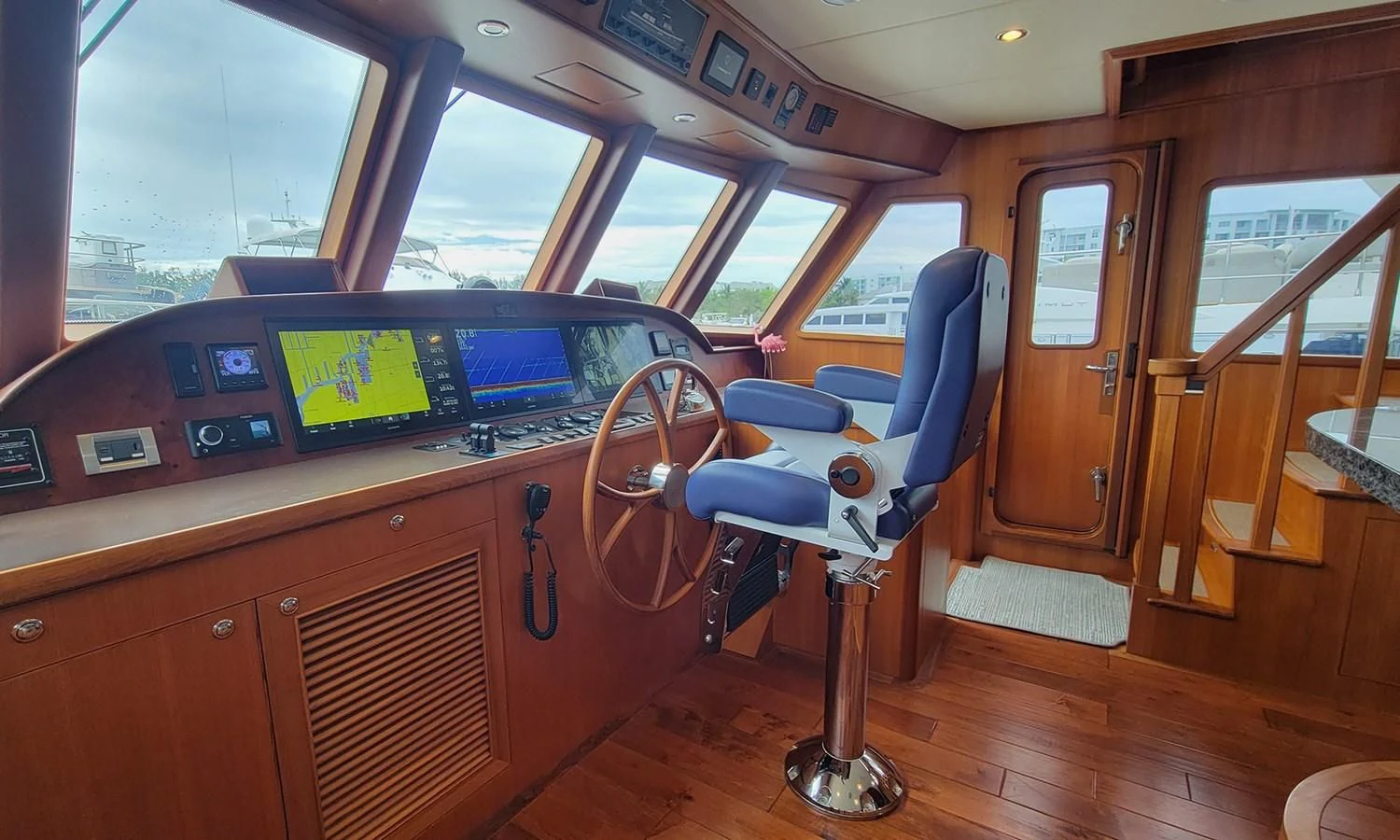 a boat with a seat and steering wheel aboard SUERTUDO Yacht for Sale