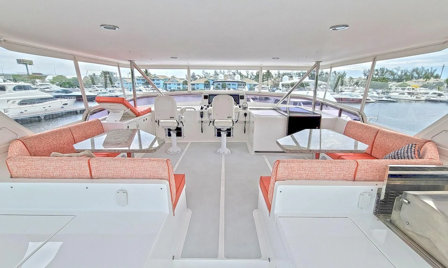 a boat with a deck and chairs aboard SUERTUDO Yacht for Sale