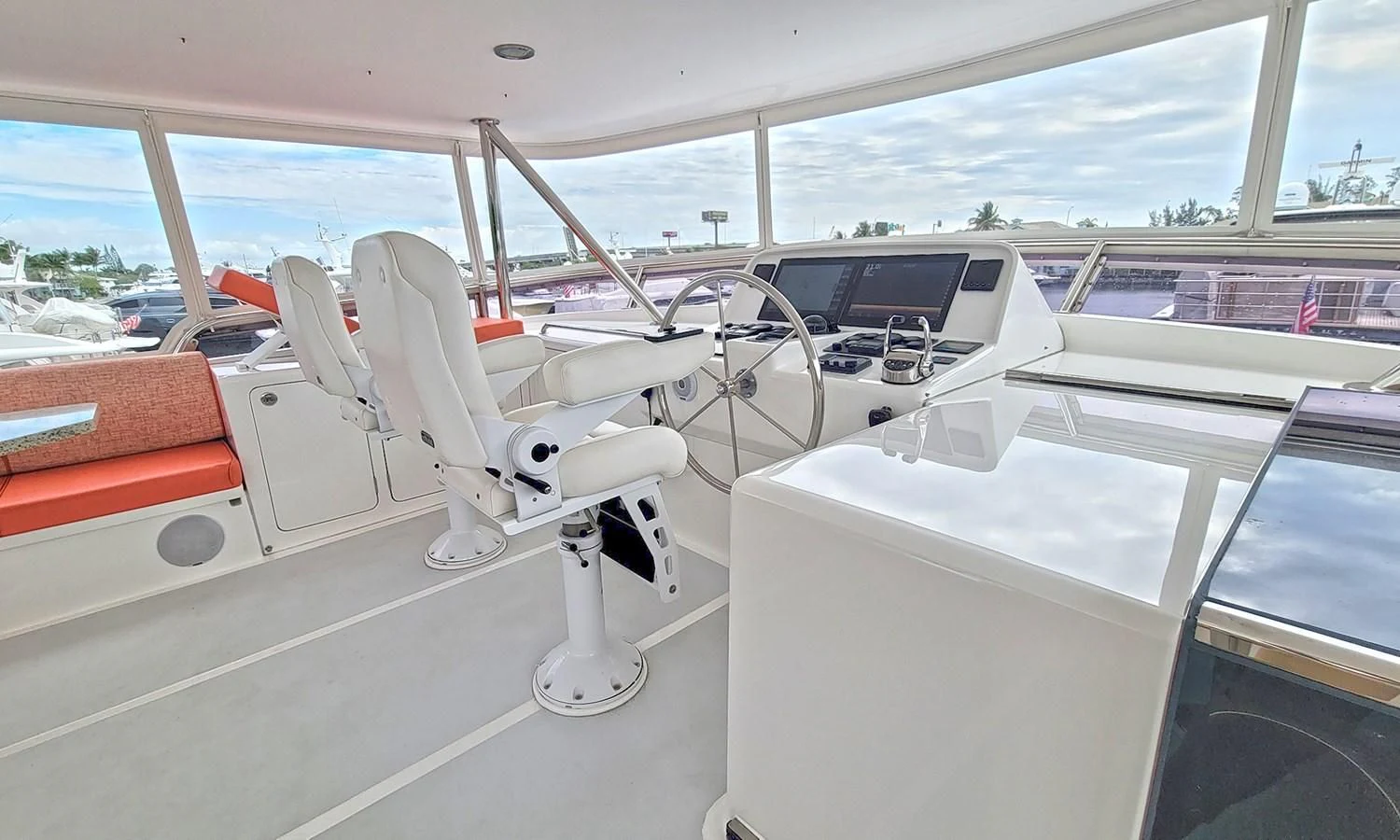 a white chair on a boat aboard SUERTUDO Yacht for Sale