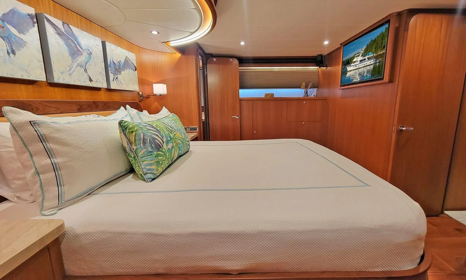 a bed with pillows aboard SUERTUDO Yacht for Sale