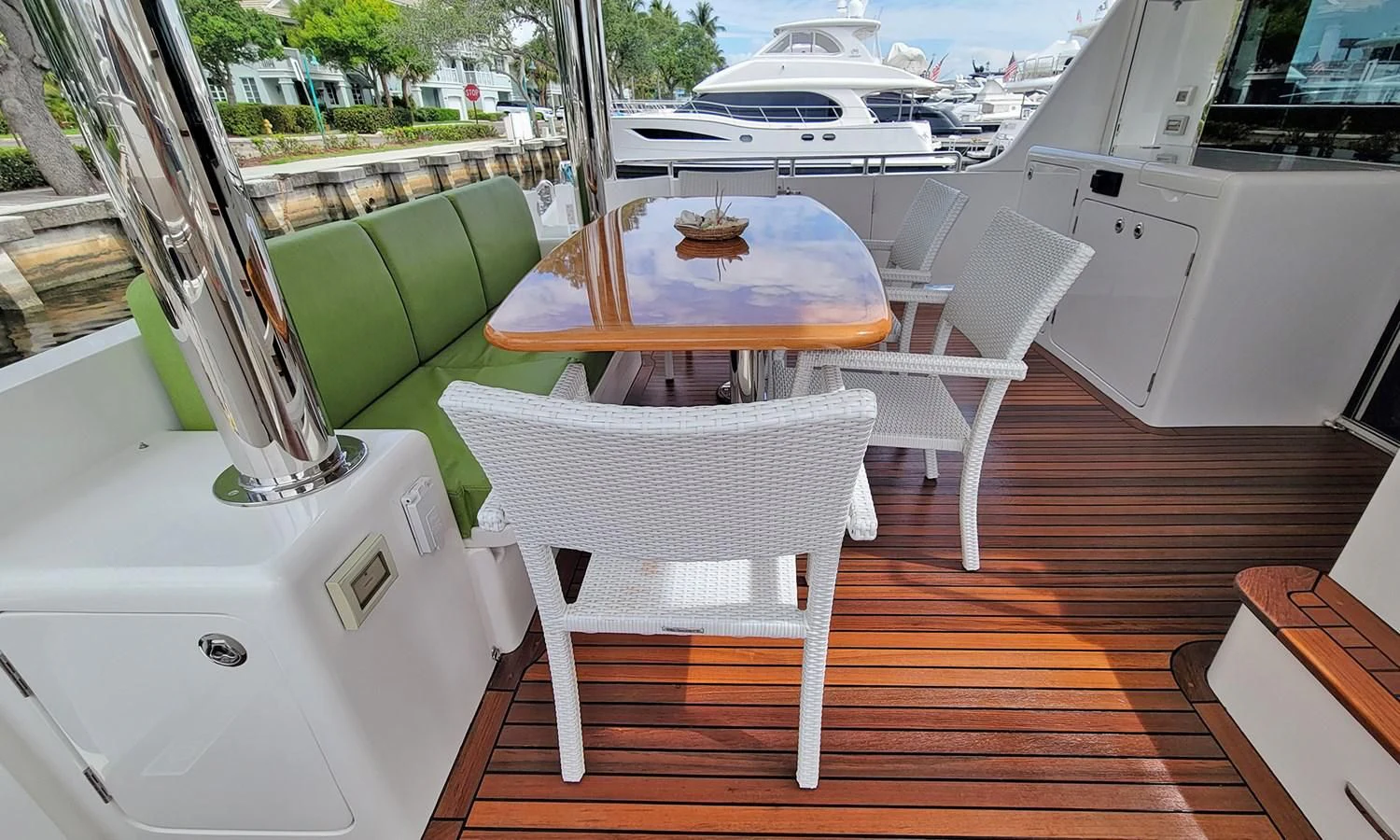 a table and chairs on a deck aboard SUERTUDO Yacht for Sale