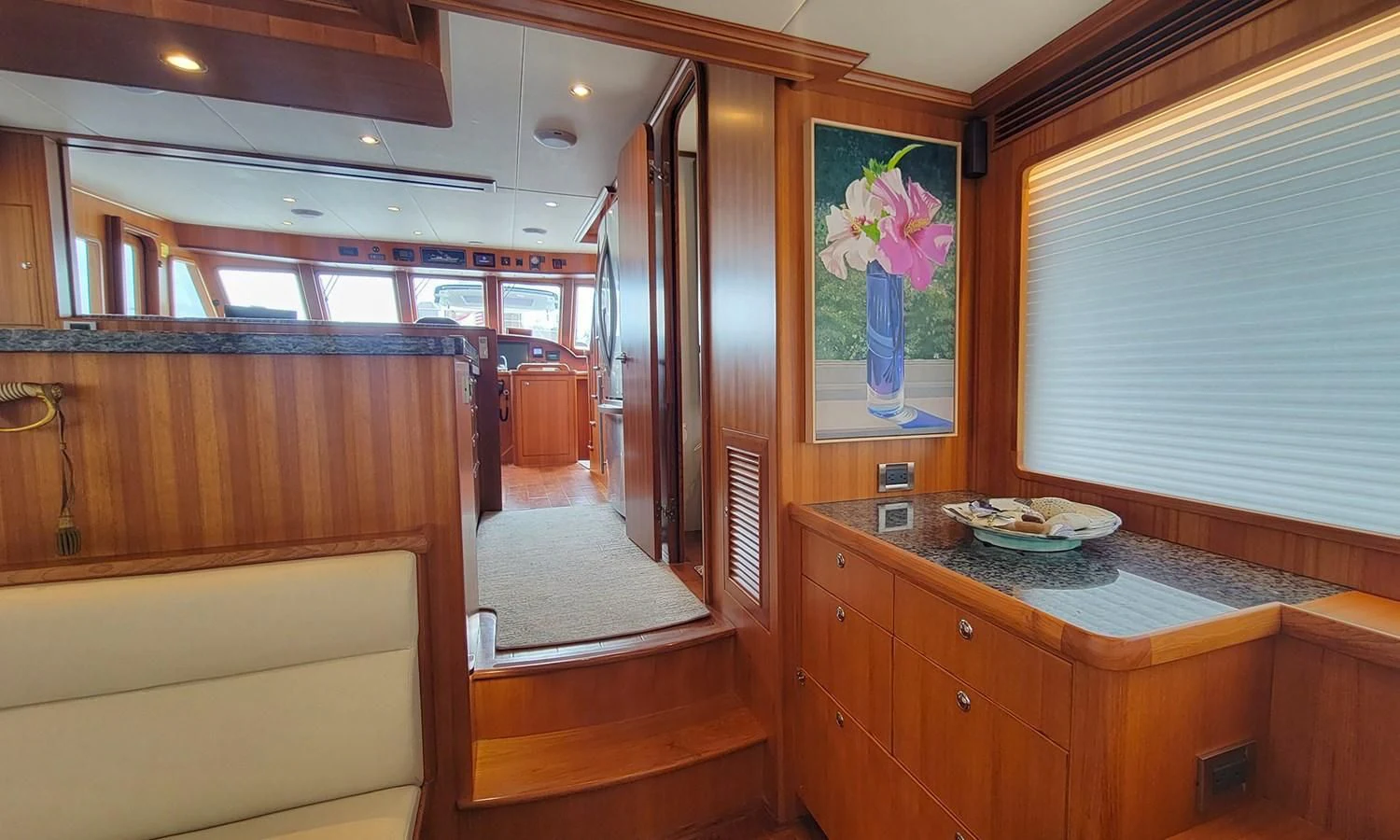 a kitchen with a countertop sink and cabinets aboard SUERTUDO Yacht for Sale