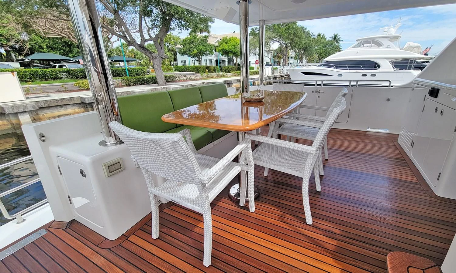 a table and chairs on a deck aboard SUERTUDO Yacht for Sale