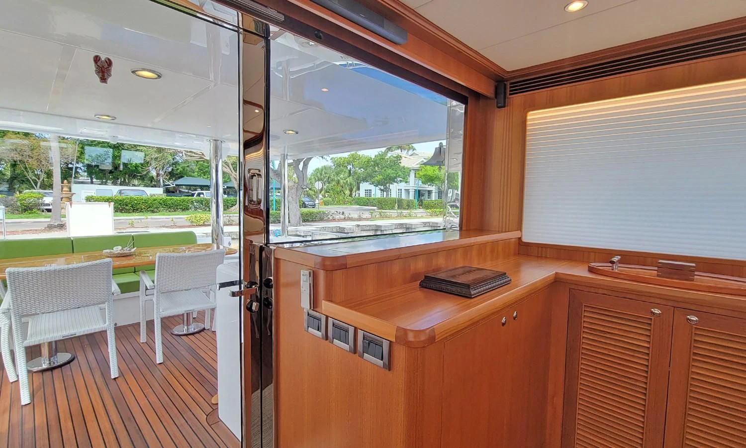 a room with a desk and chairs aboard SUERTUDO Yacht for Sale