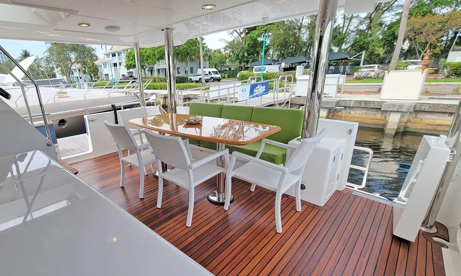a table and chairs on a deck aboard SUERTUDO Yacht for Sale