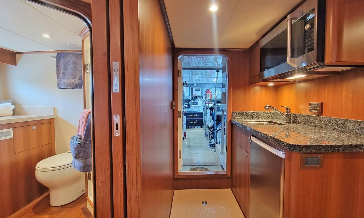 a bathroom with a glass shower door aboard SUERTUDO Yacht for Sale