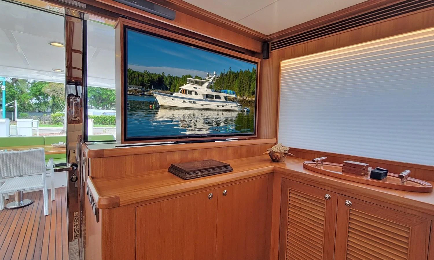 a room with a window and a view of the water aboard SUERTUDO Yacht for Sale