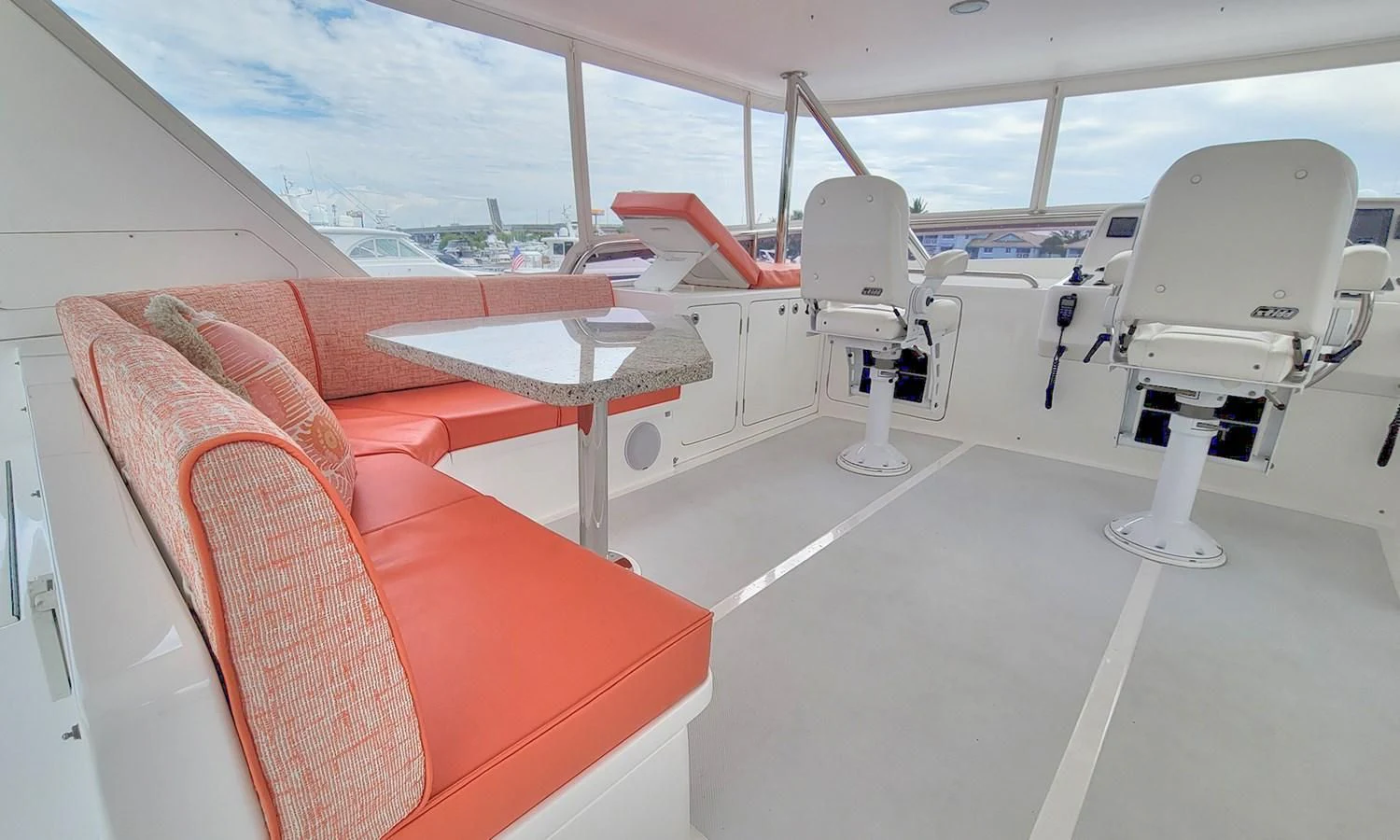 a room with a white tent and red couches aboard SUERTUDO Yacht for Sale