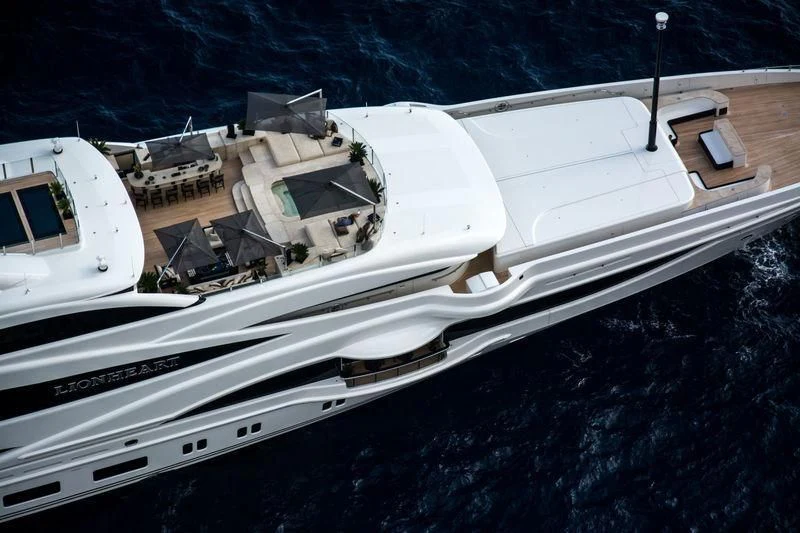 a white boat in a body of water aboard LIONHEART Yacht for Sale
