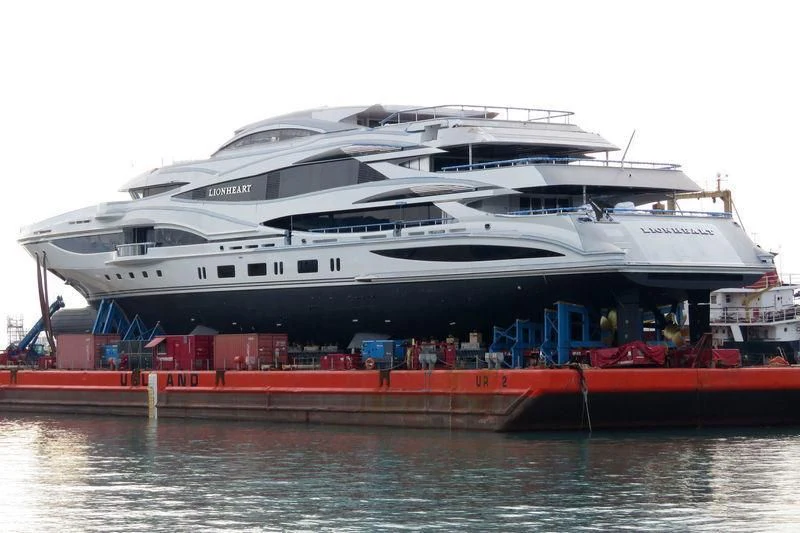 a large cruise ship docked aboard LIONHEART Yacht for Sale