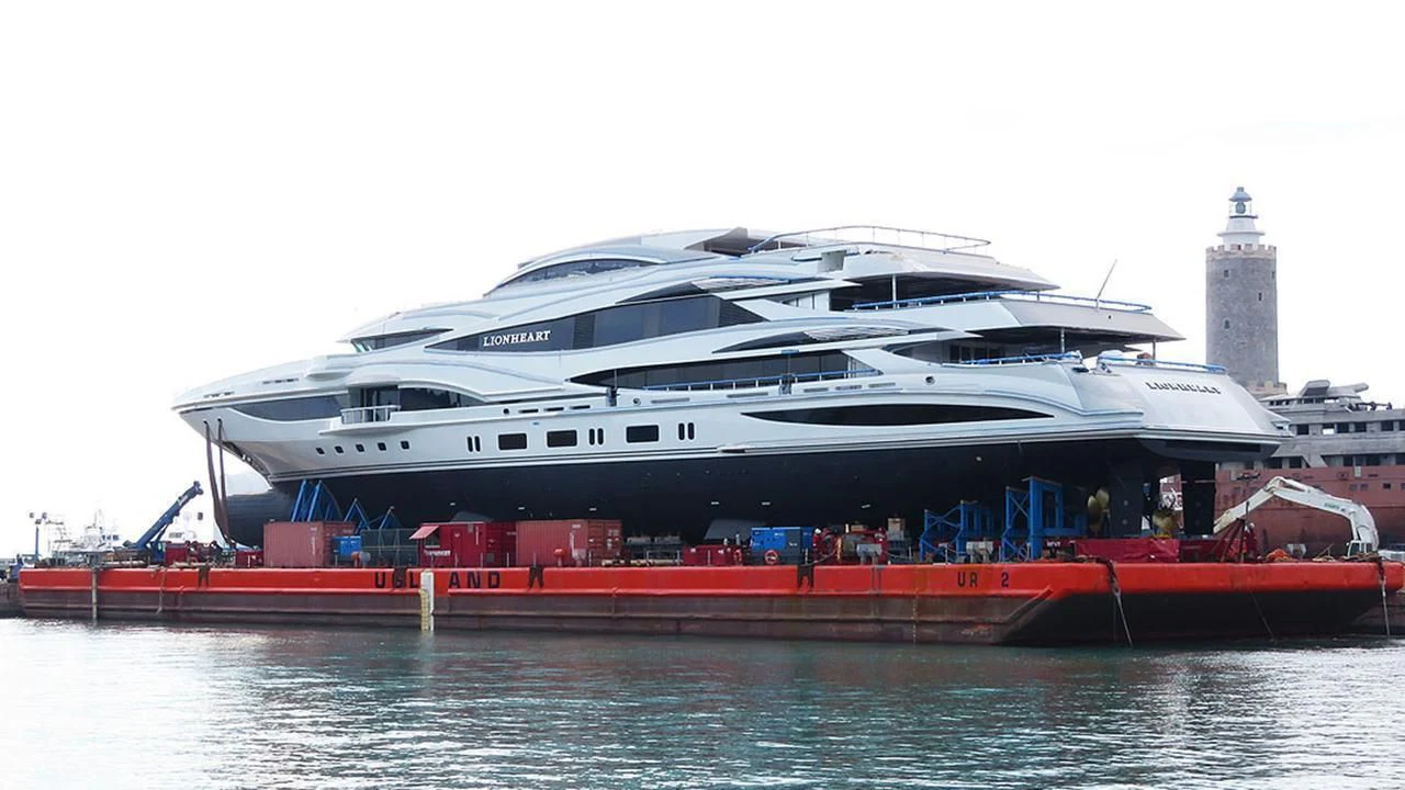 a large cruise ship docked aboard LIONHEART Yacht for Sale