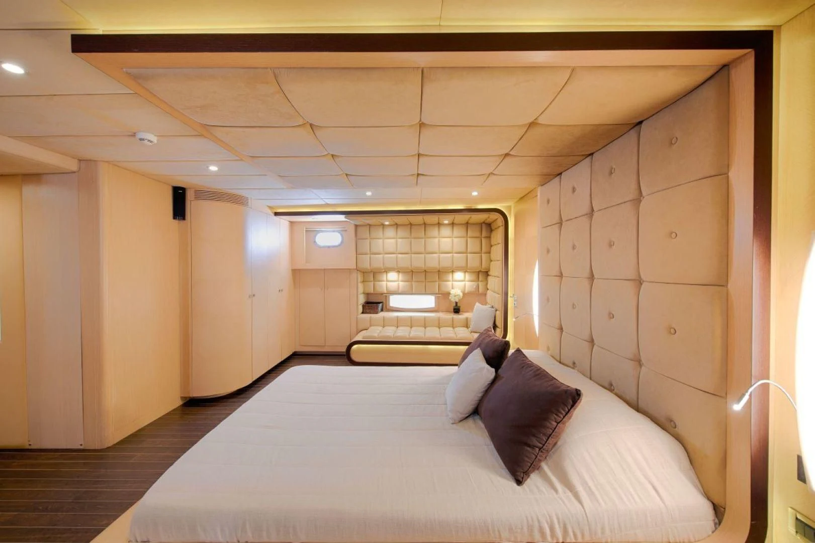 a room with a bed and a couch aboard THE WALL Yacht for Sale