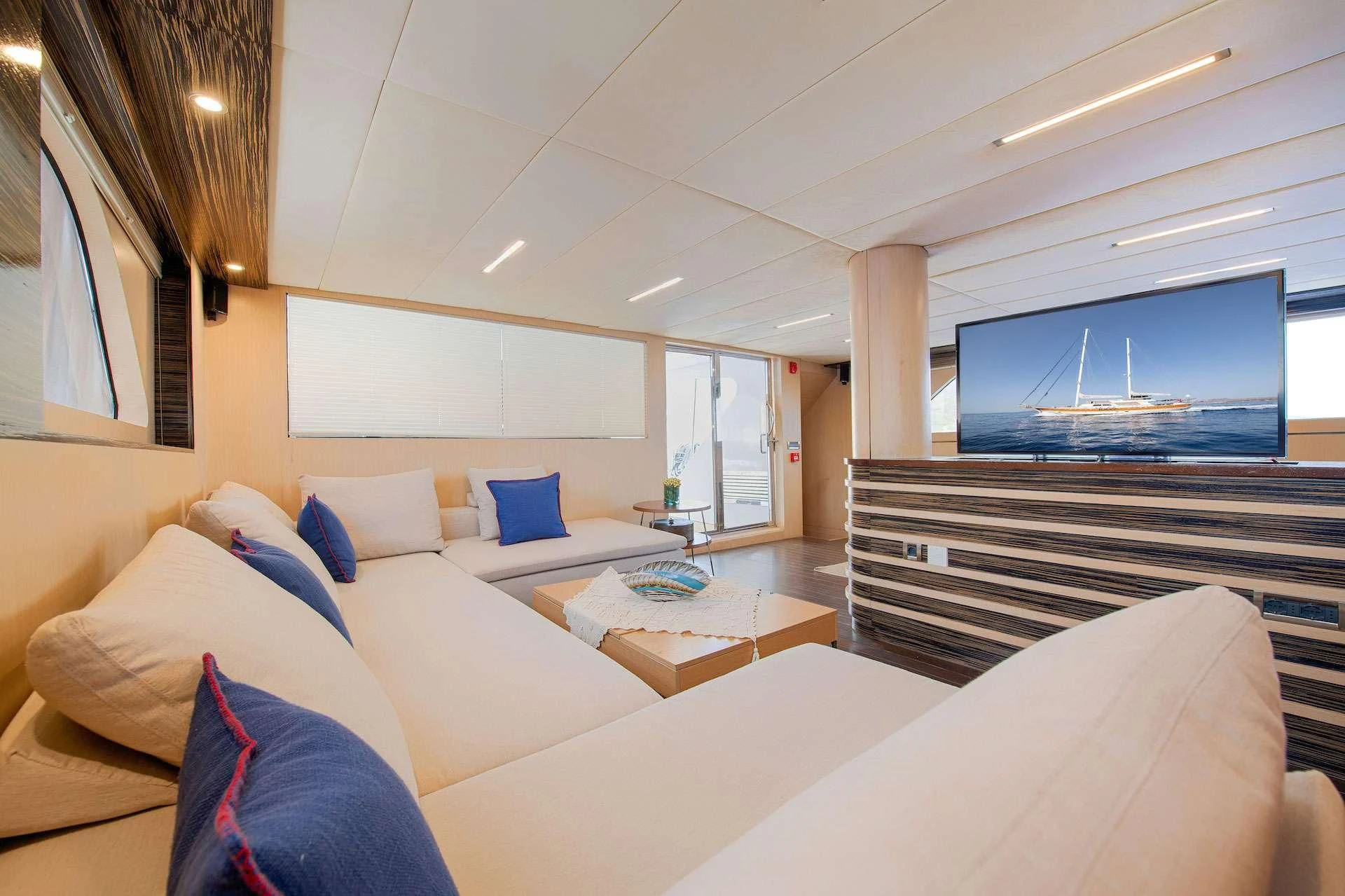 a room with a bed and a tv aboard THE WALL Yacht for Sale