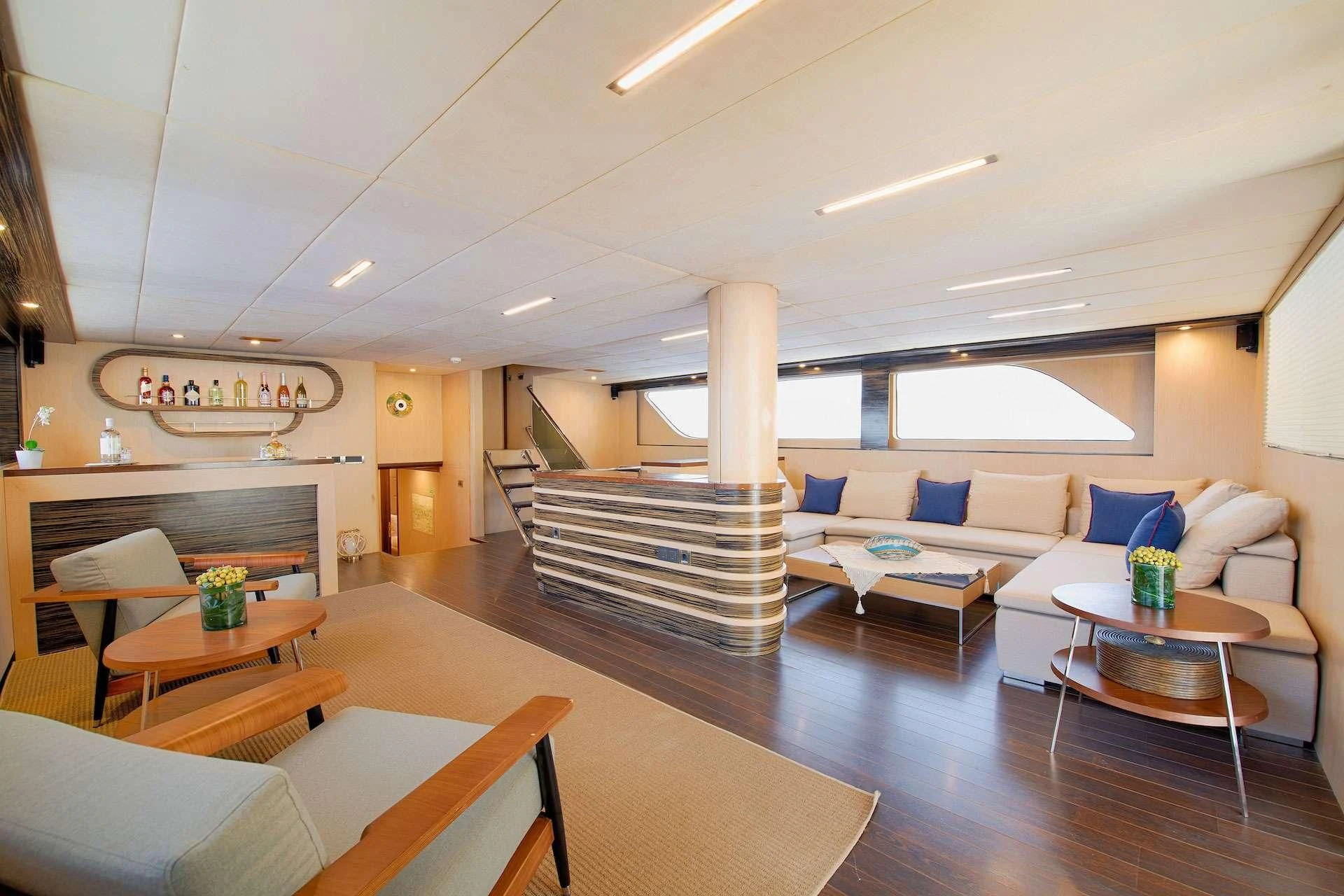 a living room with a staircase aboard THE WALL Yacht for Sale