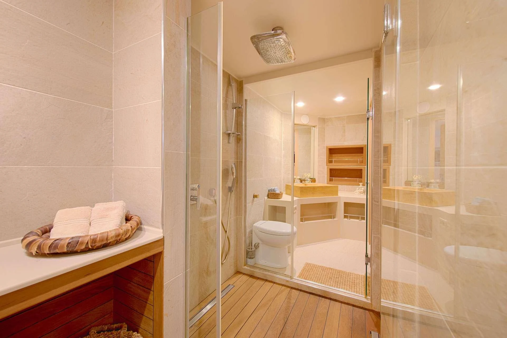 a bathroom with a glass shower aboard THE WALL Yacht for Sale