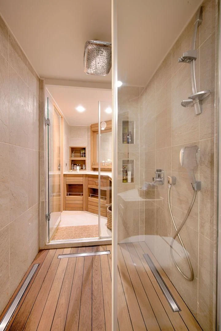 a bathroom with a shower unit and a sink aboard THE WALL Yacht for Sale