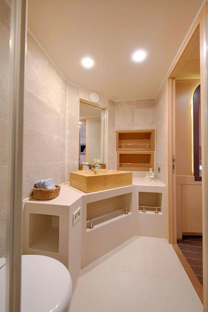 a bathroom with a sink and a toilet aboard THE WALL Yacht for Sale