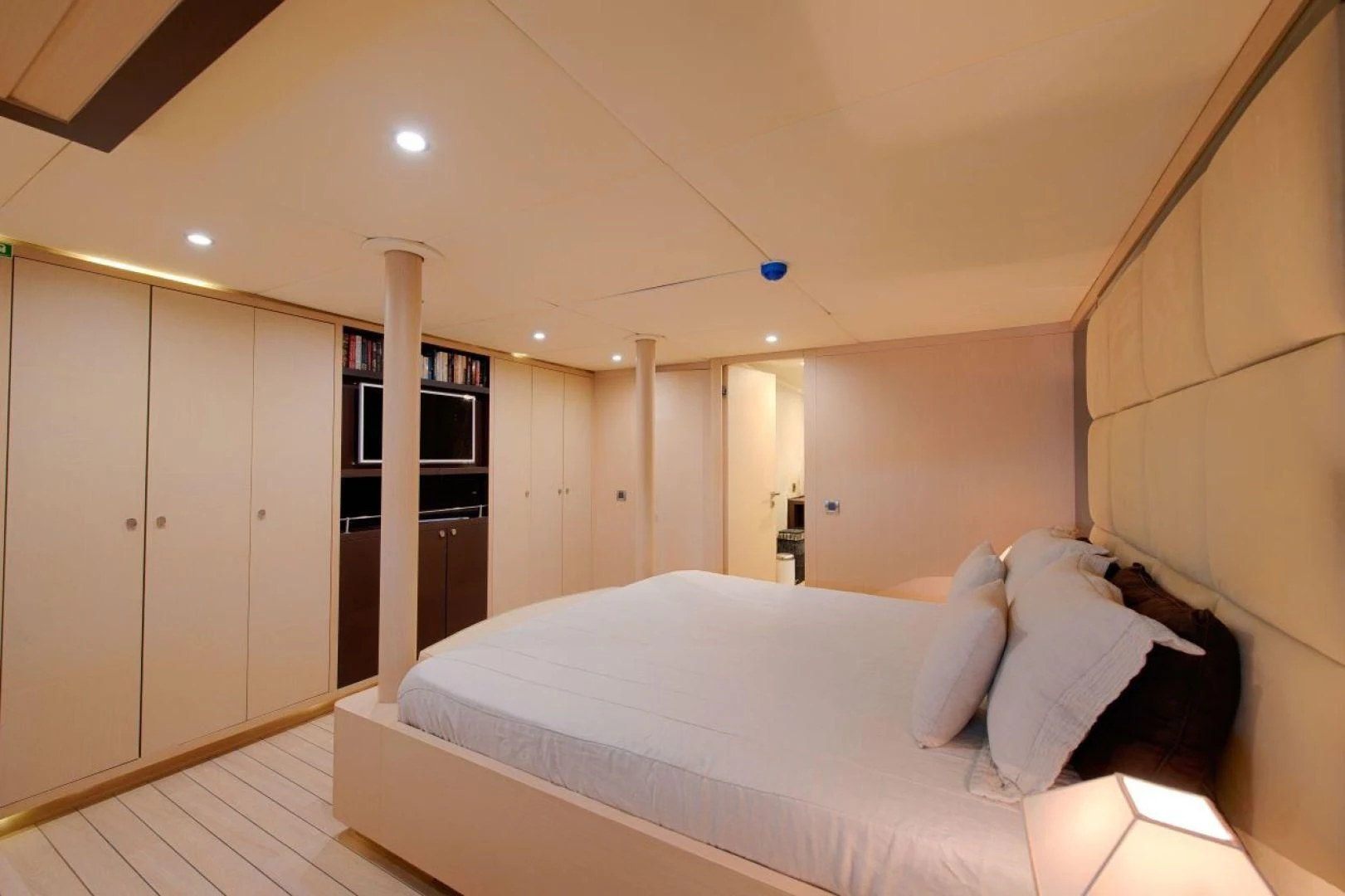 a bedroom with a bed and a closet aboard THE WALL Yacht for Sale