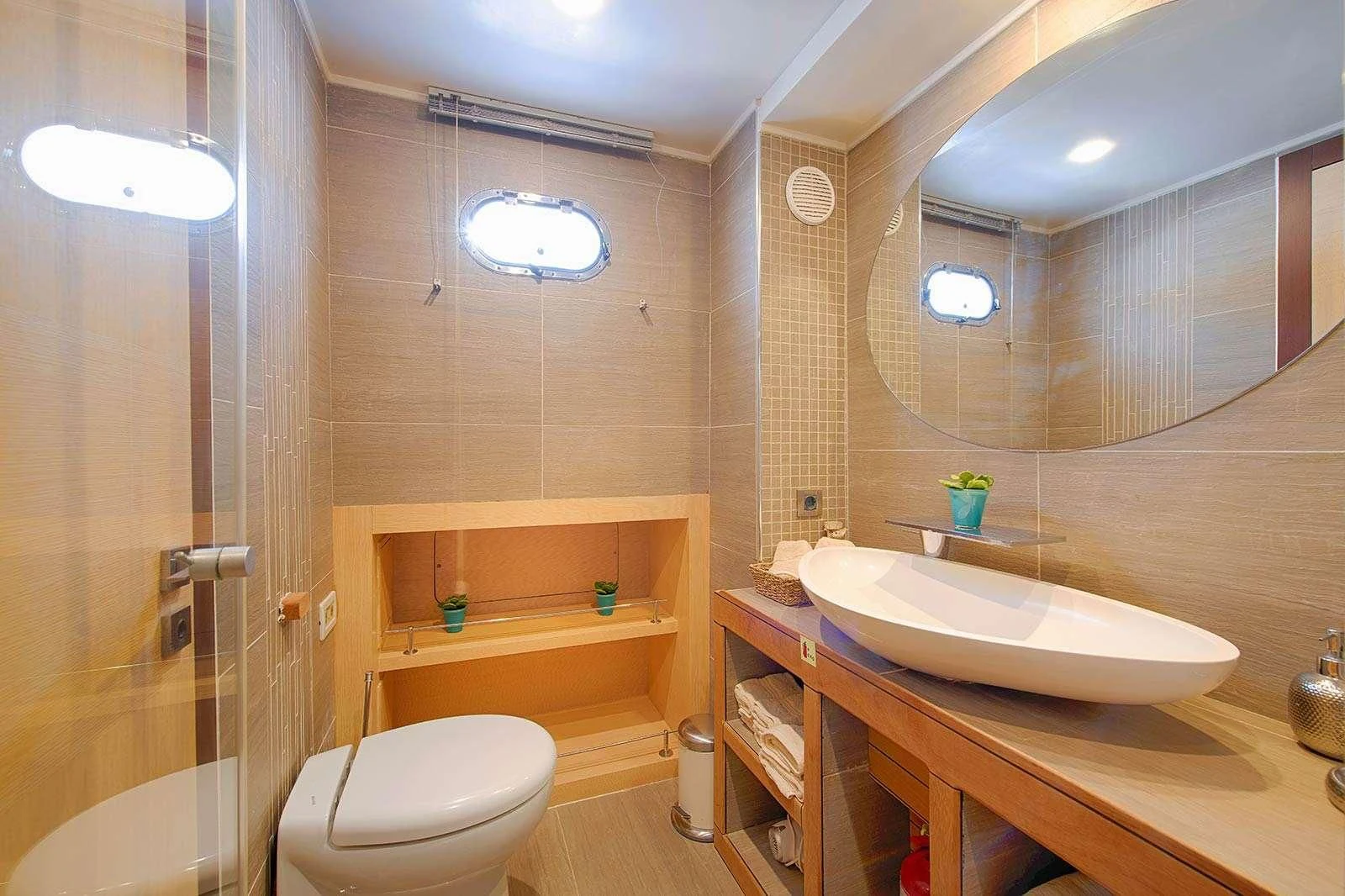 a bathroom with a sink toilet and bathtub aboard THE WALL Yacht for Sale