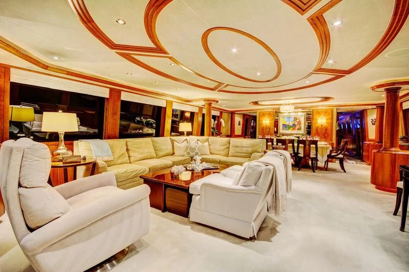 a living room with a large chandelier aboard LADY GRAY Yacht for Sale