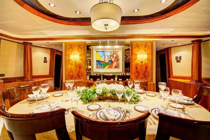 a large dining room with a table set for a formal dinner aboard LADY GRAY Yacht for Sale