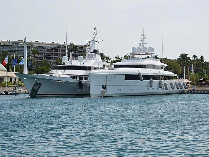 a couple of large white boats in the water aboard JC Yacht for Sale