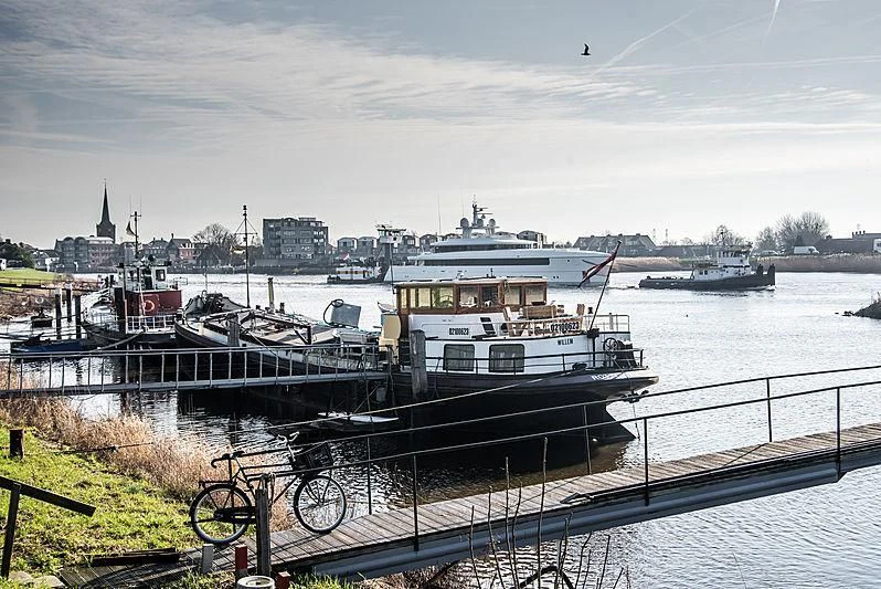 a large boat is parked at a dock aboard JC Yacht for Sale