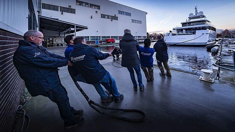 a group of people on a dock by a boat aboard JC Yacht for Sale