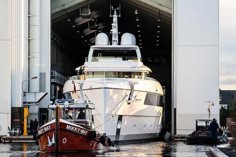 a large boat is parked in a harbor aboard JC Yacht for Sale