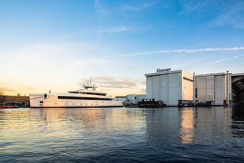 a large cruise ship docked at a port aboard JC Yacht for Sale