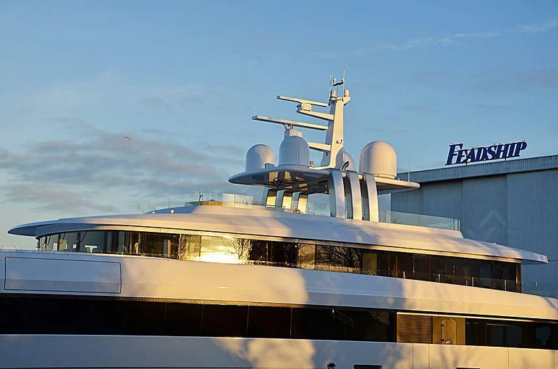 a large boat with a satellite on top aboard JC Yacht for Sale