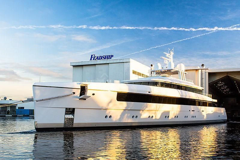 a white yacht in the water aboard JC Yacht for Sale