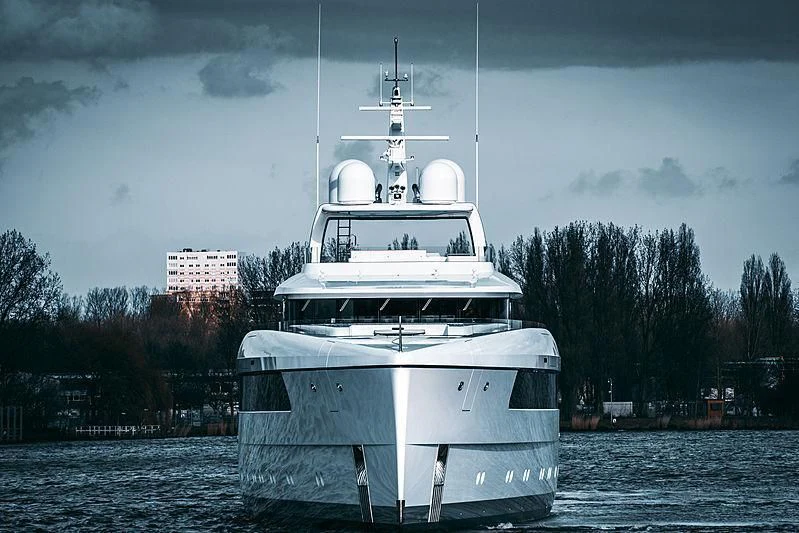 a white boat in the water aboard JC Yacht for Sale