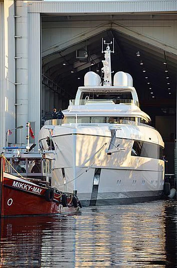 a couple of boats sit in a harbor aboard JC Yacht for Sale