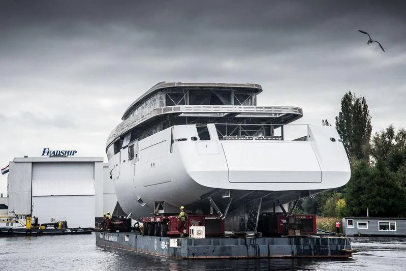 a large white boat docked aboard JC Yacht for Sale