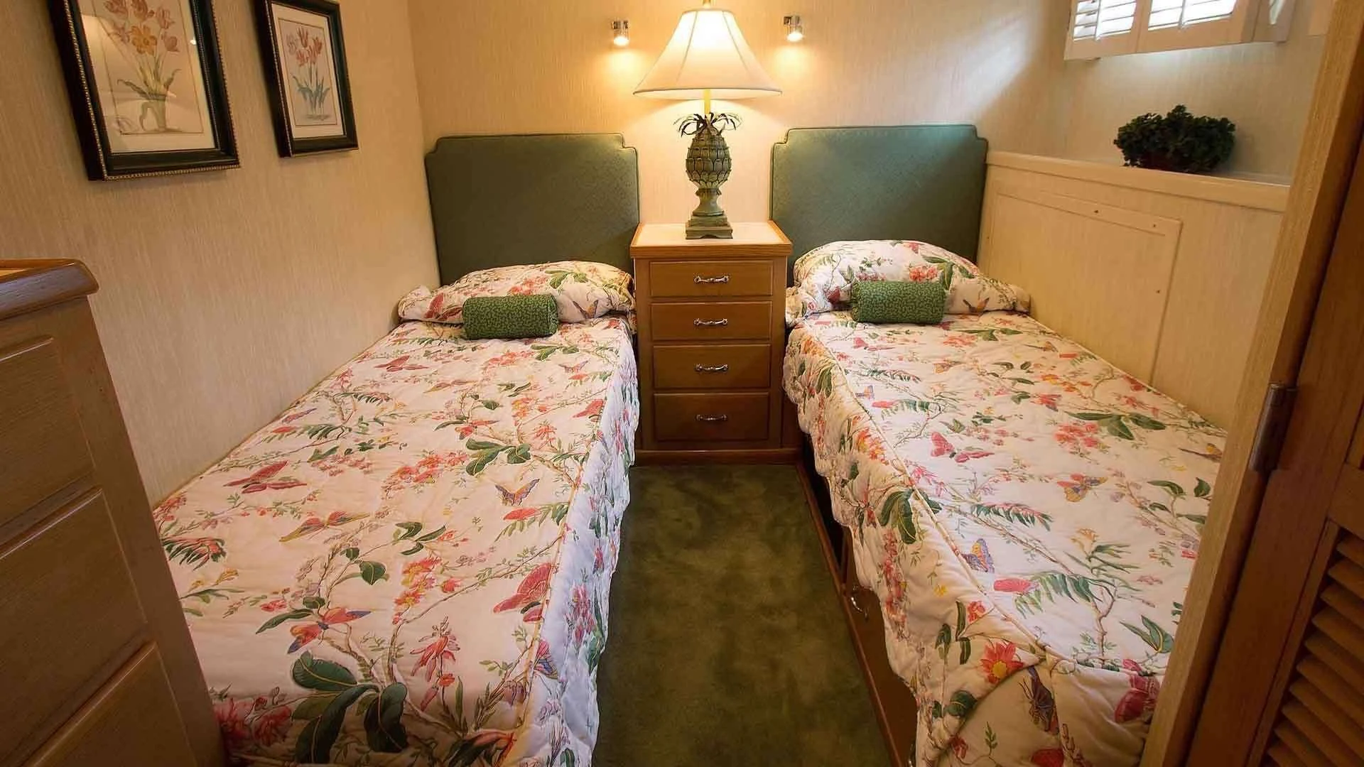 a bedroom with a bed and a lamp aboard KOALA Yacht for Sale