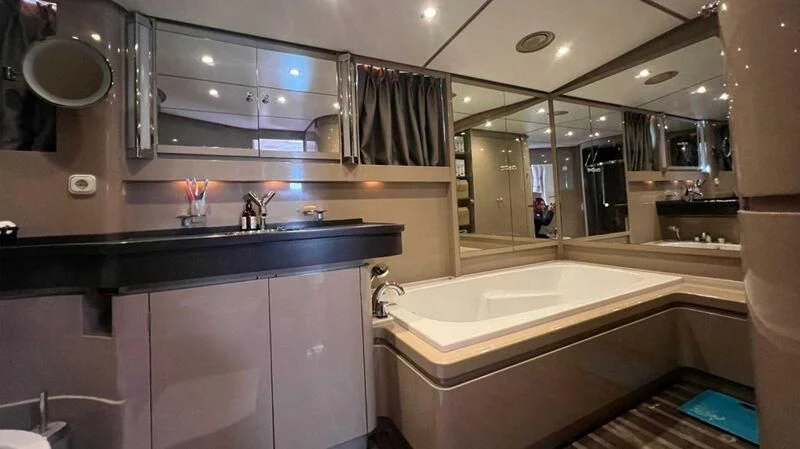 a bathroom with a large mirror aboard BLUE FASCINATION Yacht for Sale