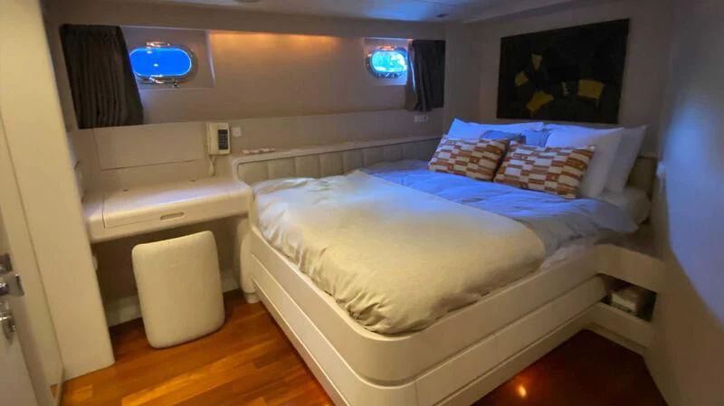 a bed in a room aboard BLUE FASCINATION Yacht for Sale