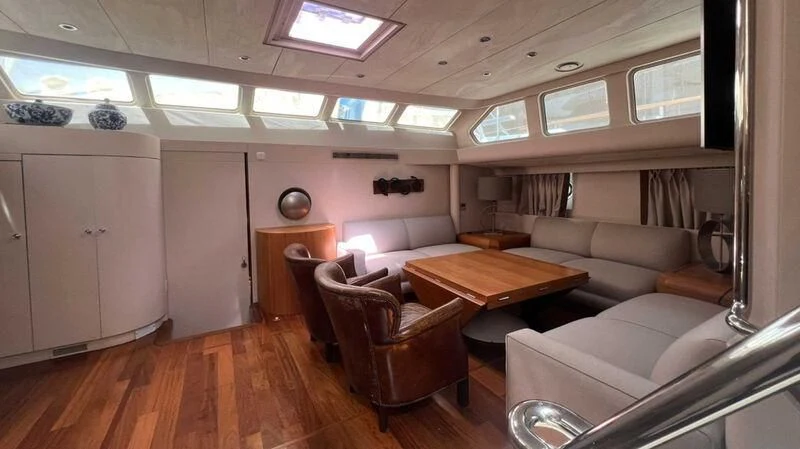 a living room with a couch and a table aboard BLUE FASCINATION Yacht for Sale