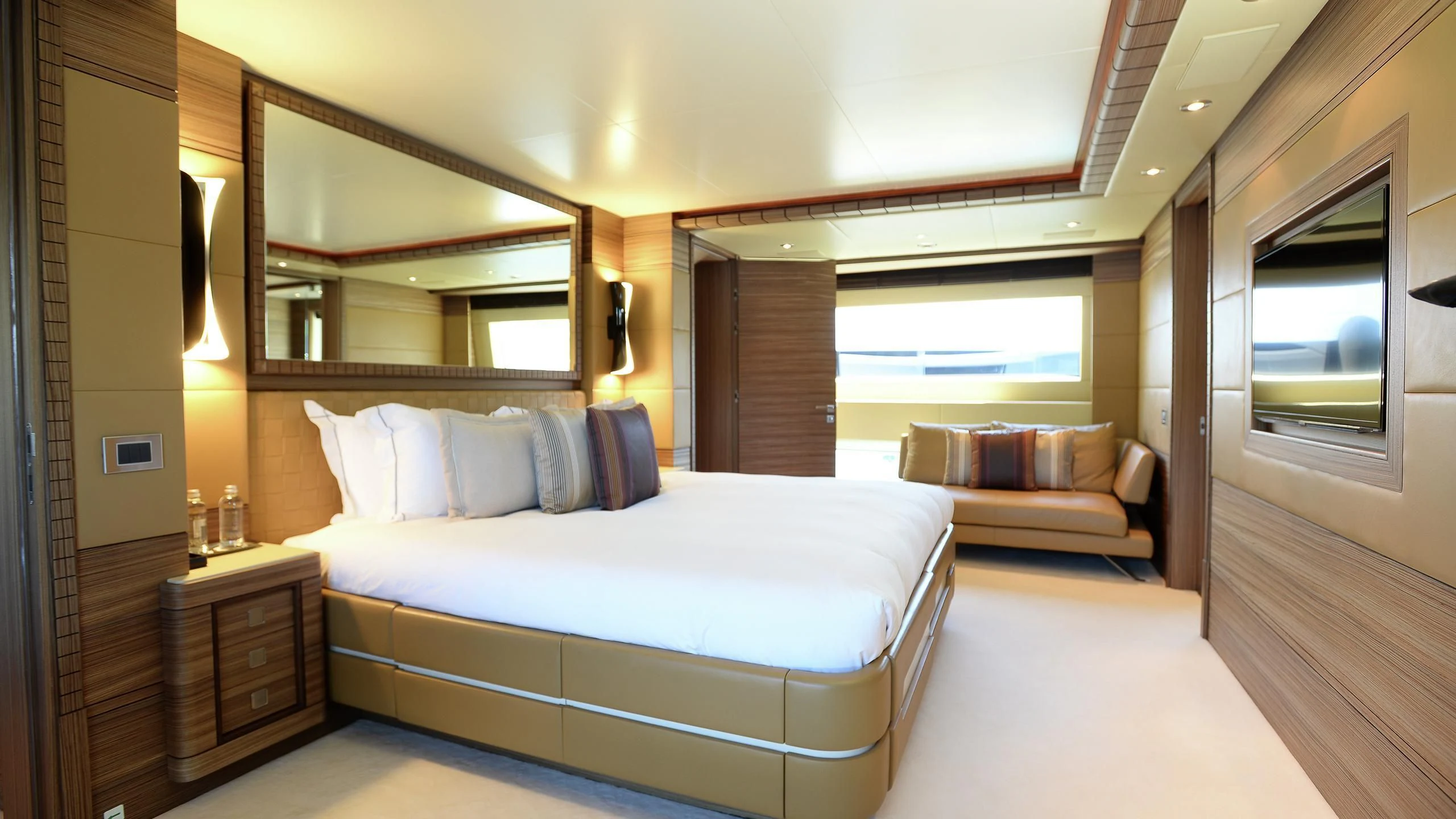a large bedroom with a large bed aboard ORYX Yacht for Sale