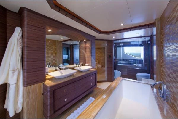 a bathroom with a large mirror aboard ORYX Yacht for Sale