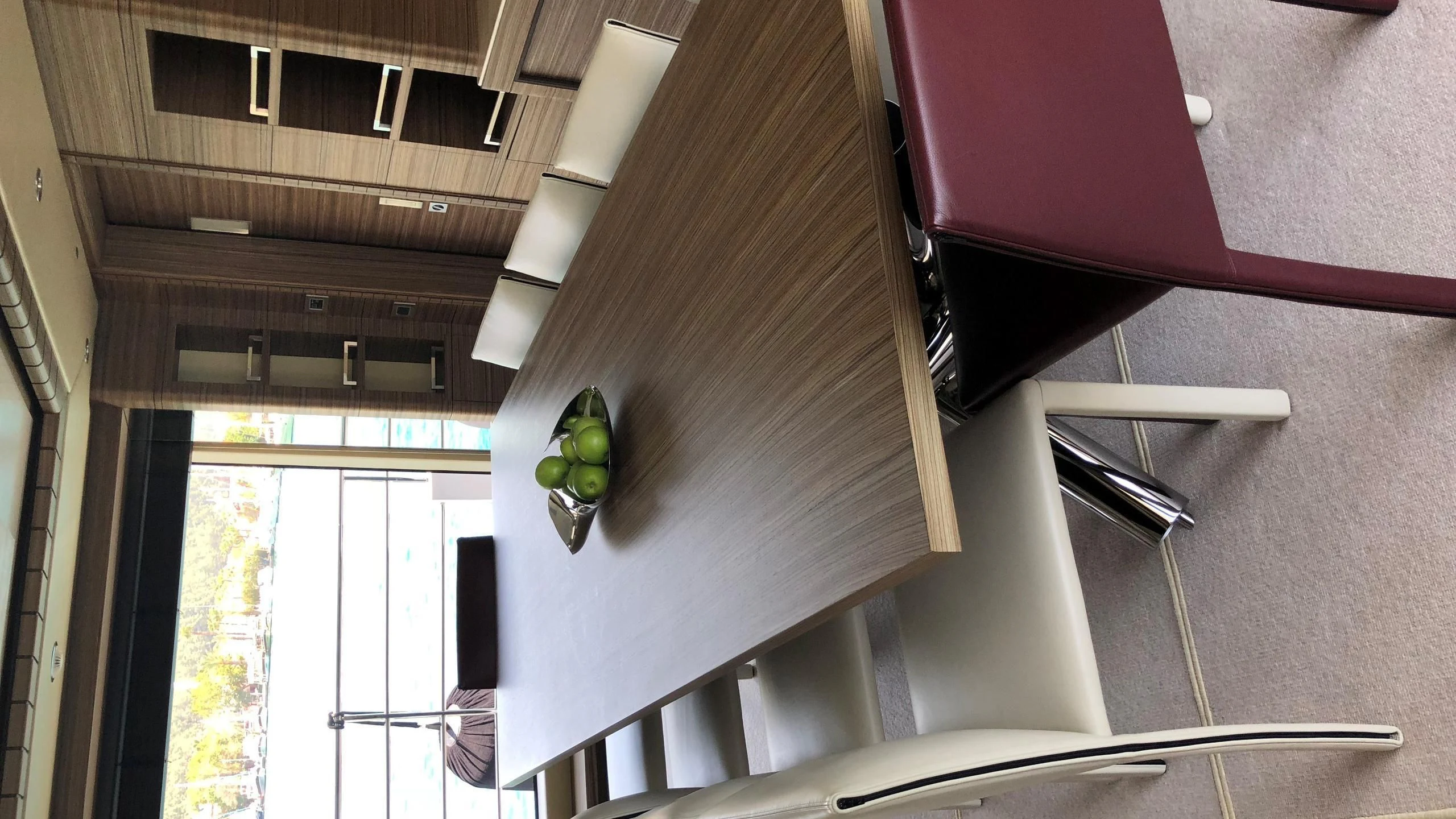 a room with a staircase and a green apple on the ceiling aboard ORYX Yacht for Sale