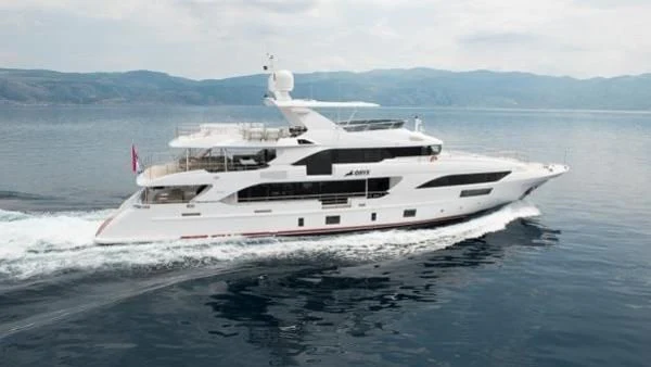 a white yacht on the water aboard ORYX Yacht for Sale