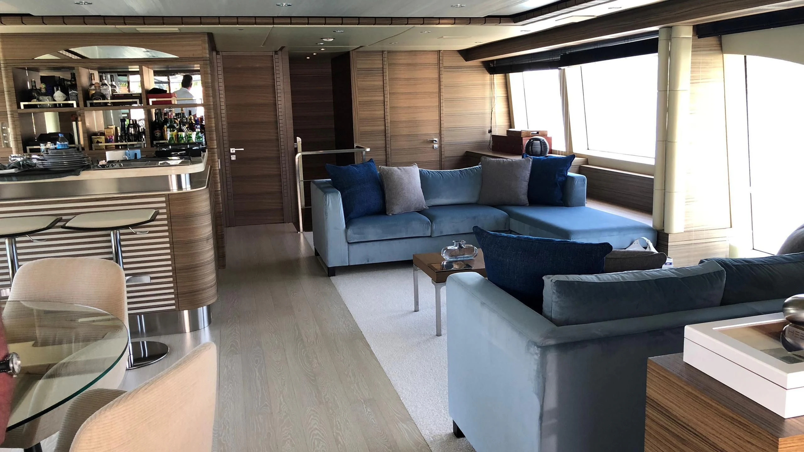 a living room with a couch and a table aboard ORYX Yacht for Sale