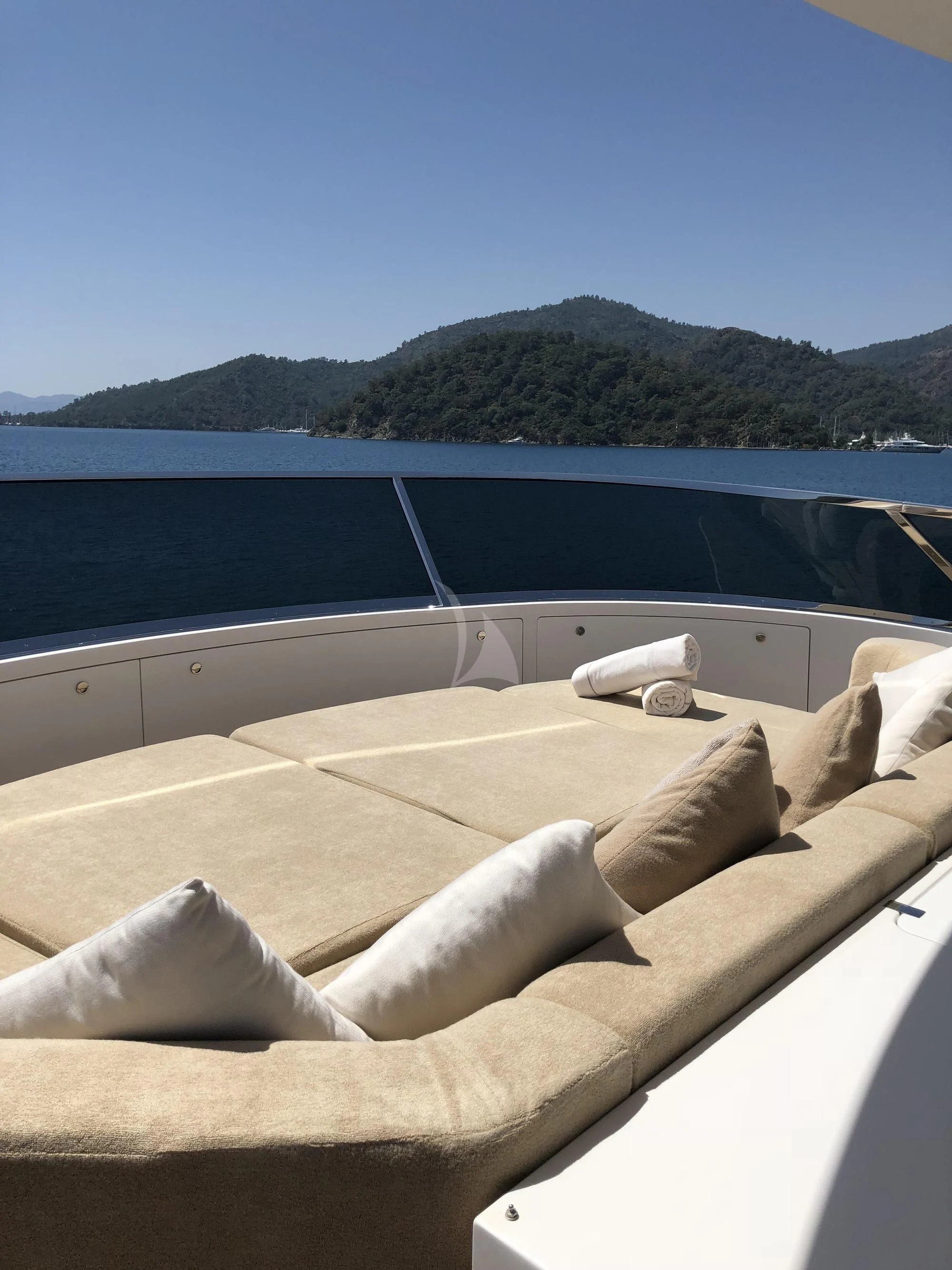 a room with a view of the ocean and mountains aboard ORYX Yacht for Sale