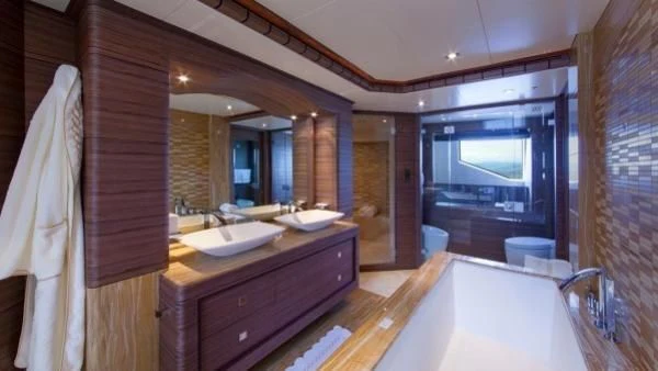 a bathroom with a large mirror aboard ORYX Yacht for Sale