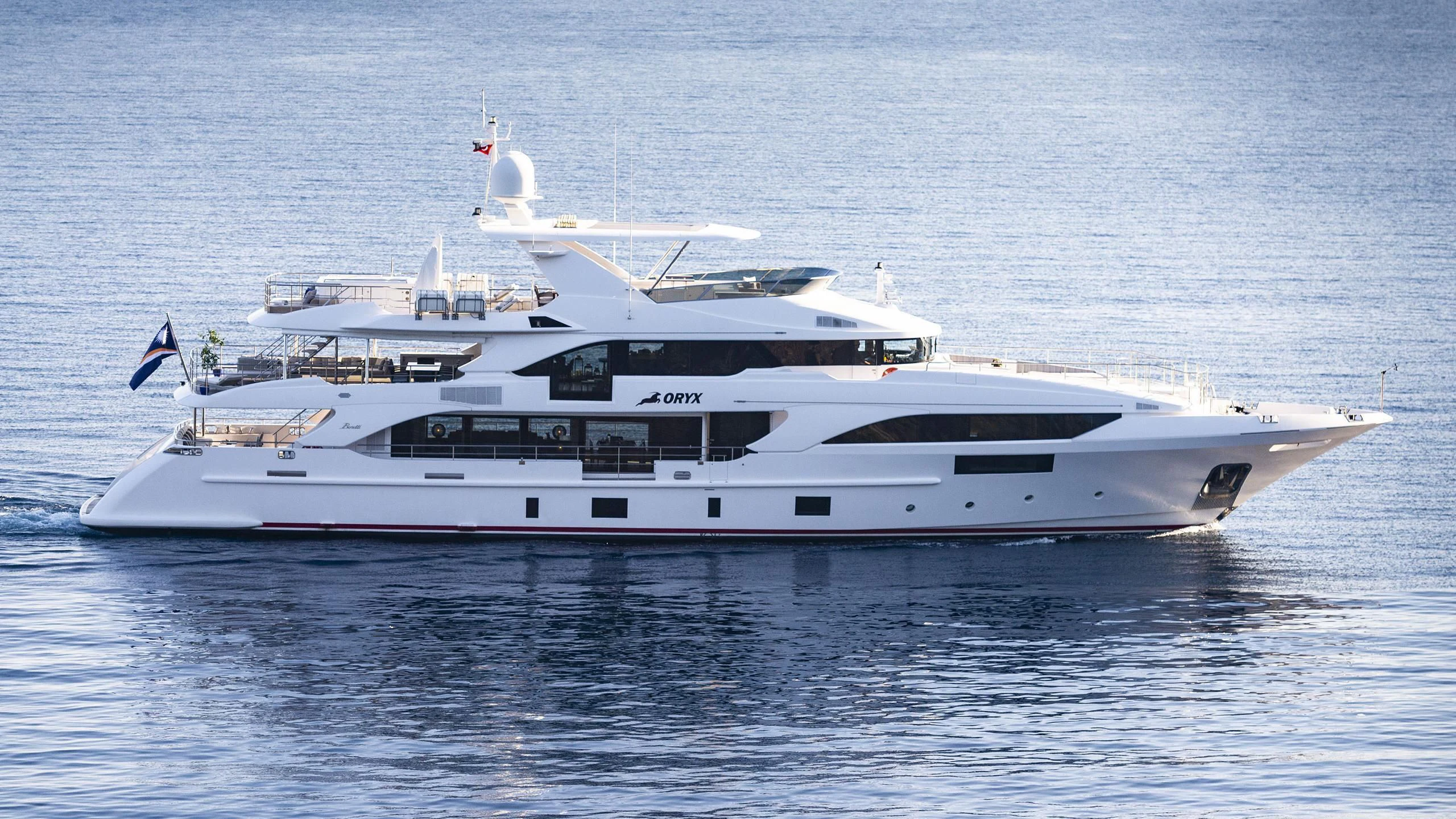 a white yacht in the water aboard ORYX Yacht for Sale
